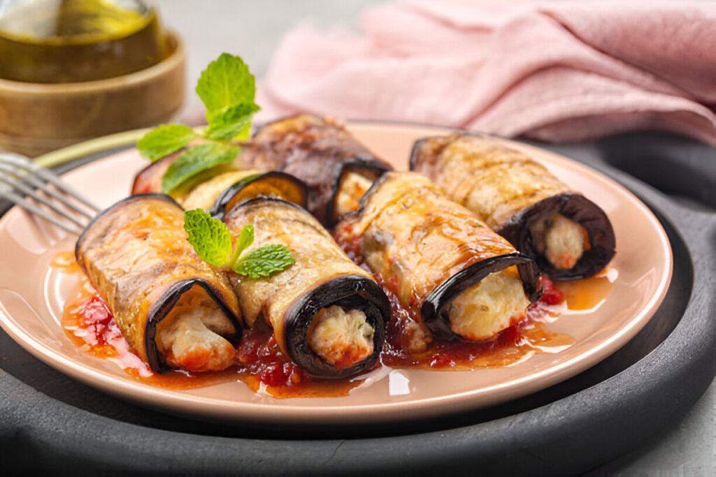 eggplant roll ups with ricotta parmesan cheese and tomato sauce