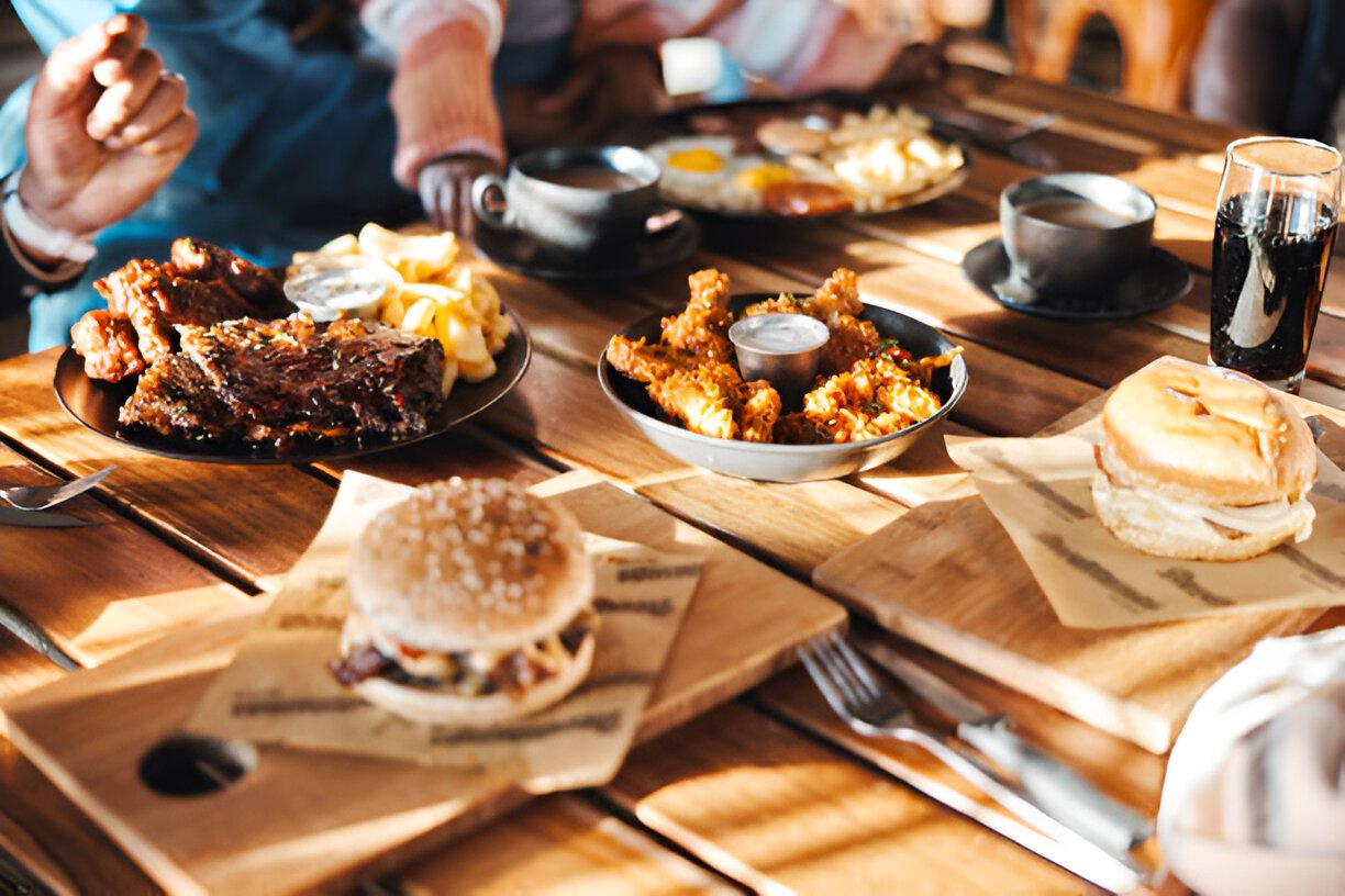 fast food lunch or dinner on table at restaurant people eating