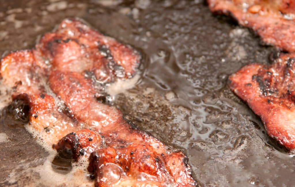 roasted beacon pieces in the oil