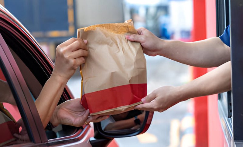 drive thru fast food restaurant staff serving