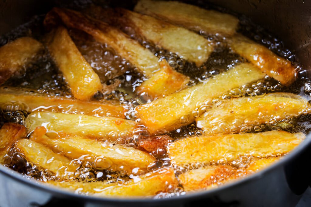 french fries fry in hot bubbling oil