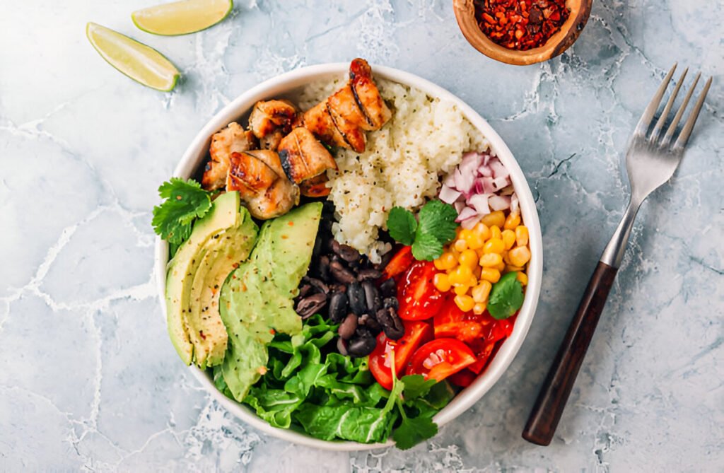 mexican chicken burrito bowl with rice beans tomato avocado